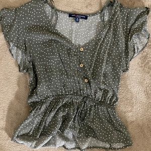 Green polka dot flows top